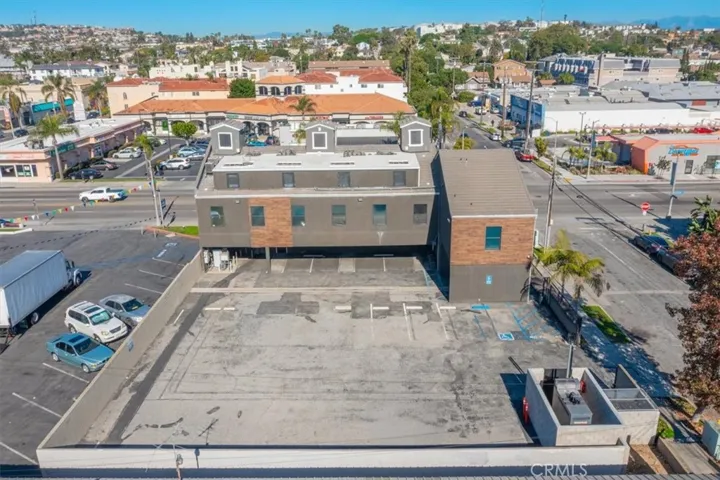 Elevated rooftop views showcasing the city and nearby coastal areas.