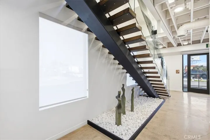 Stunning architectural staircase with custom railings and a modern design.