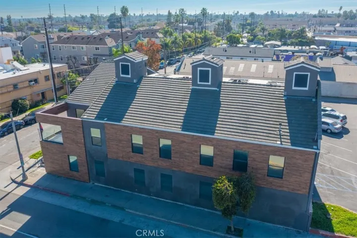 Wide-angle shot highlighting the architectural beauty and surrounding neighborhood.