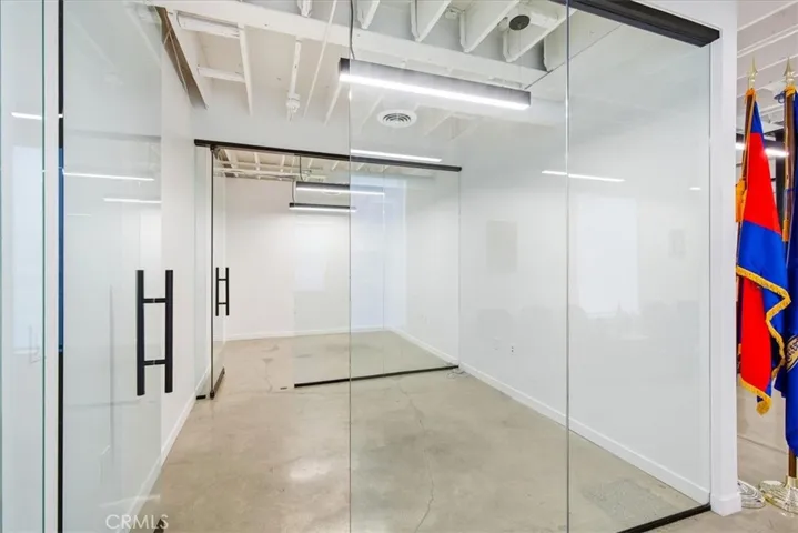 Spacious, open area ideal for flexible use or additional workspace.