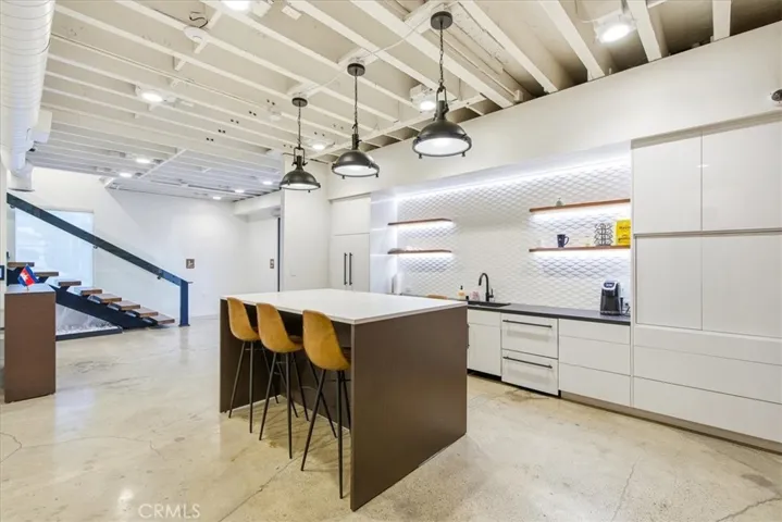 Stylish kitchen featuring a large island, clean lines, and high-end finishes.
