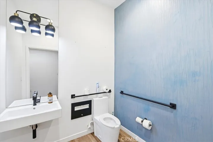 Contemporary bathroom design with crisp blue accents and high-end finishes.