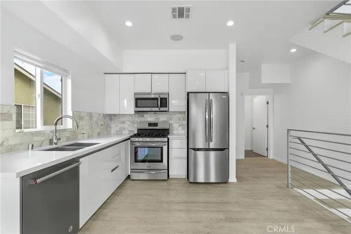 Quartz counter and Natural stone back spash .