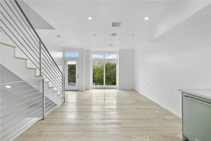High ceiling with recess light and ton of natural light