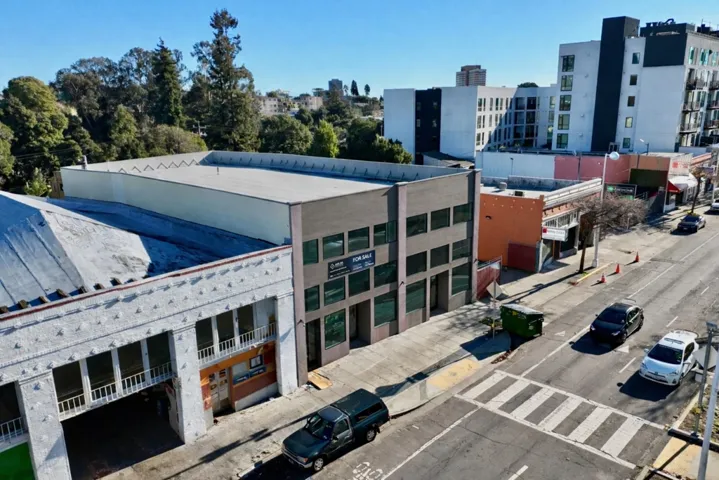 View of property with uncovered parking