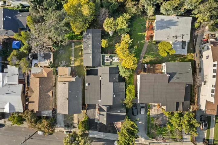 Aerial view of property's location with nearby suburban area