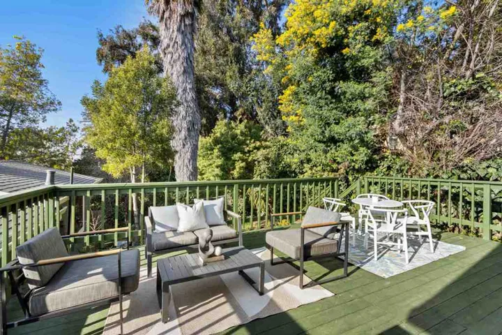 Deck featuring outdoor dining space and an outdoor living space