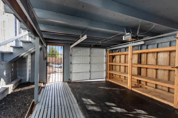 Garage featuring a garage door opener