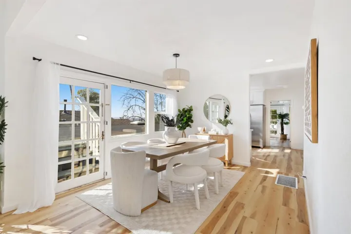 Dining room featuring light wood-type flooring and recessed lighting