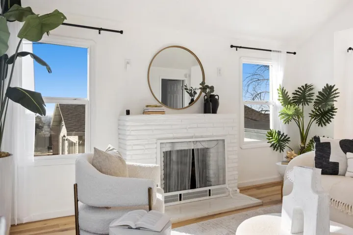 Living room featuring a fireplace and wood finished floors