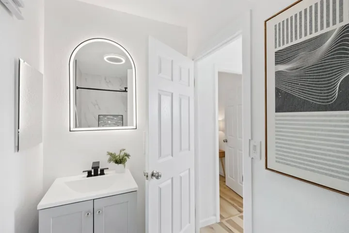 Full bathroom featuring vanity and a shower