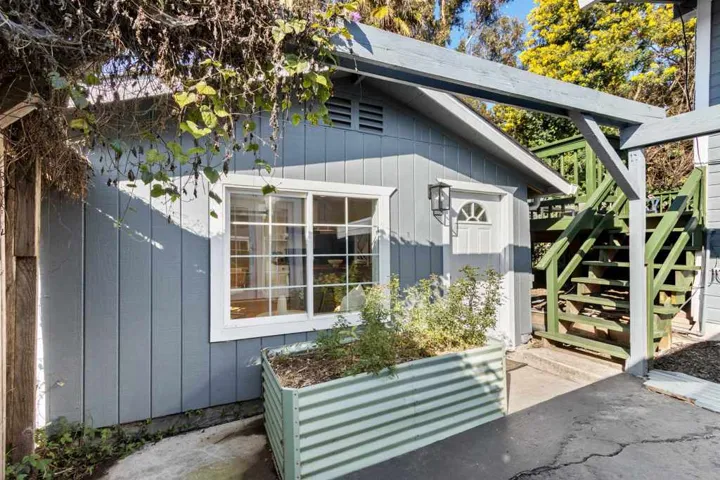 View of home's exterior with stairs