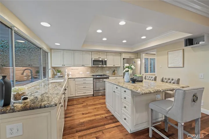 Grand kitchen with a large kitchen island.