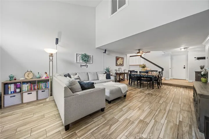 Spacious Living Room with Oversized Furniture and Dining Table, a great space for entertaining.