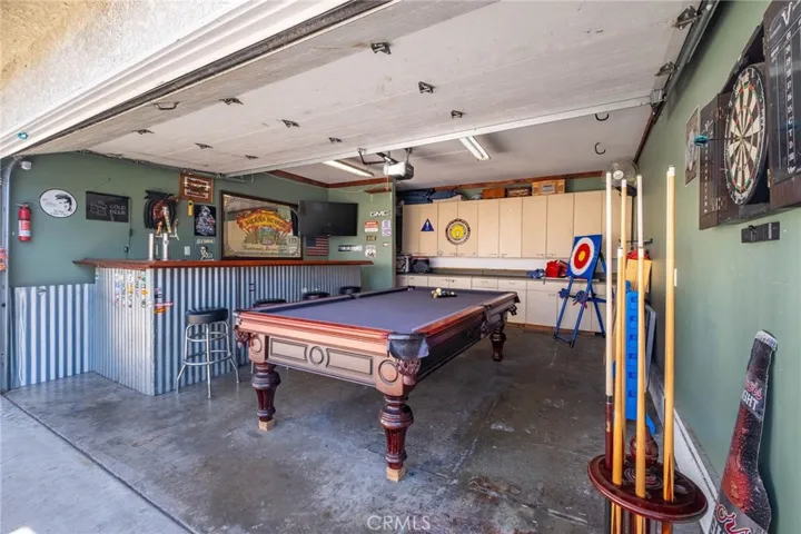Garage Currently Serves as a Versatile Entertainment Space for the Family.