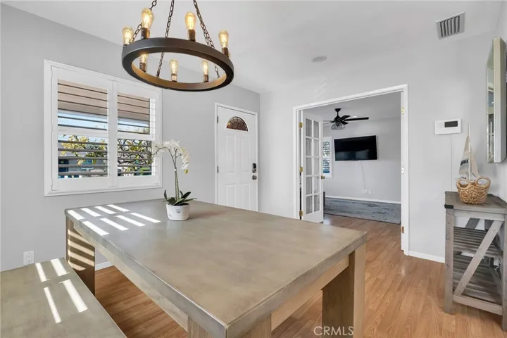 Front Dining Area, View of Front Door and Front Living Room.
