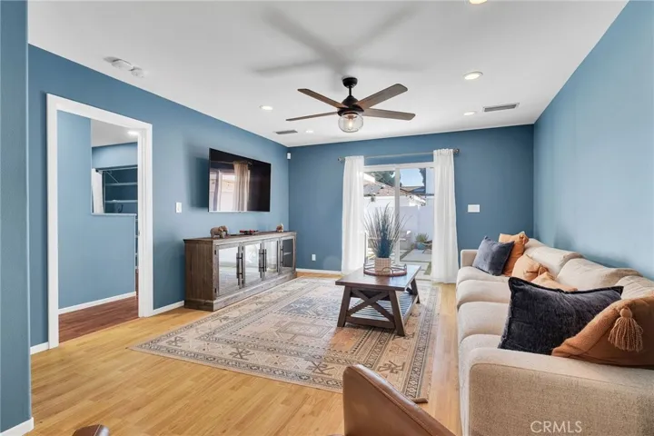 View of Your Family Room, Rear Sliding Door & Primary Bedroom Entry Door.