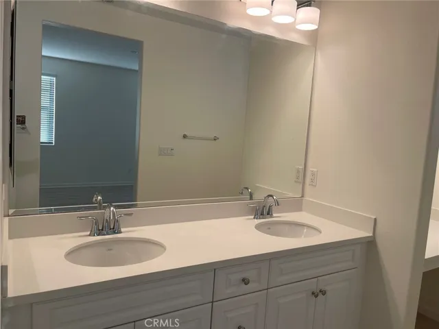 Dual sink in the hallway bathroom
