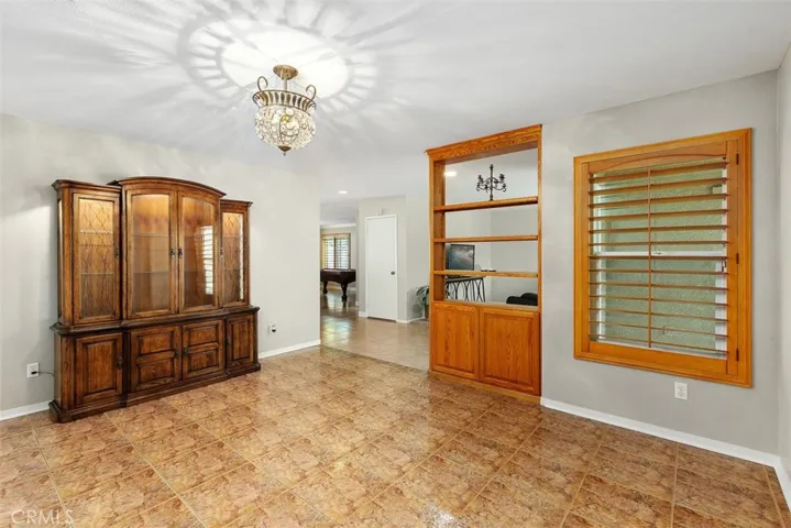 Formal Dining Room off the Entry way connects to the Kitchen.