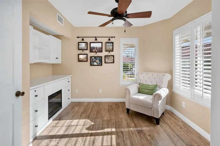 Downstairs Bedroom with built-ins and faux fireplace