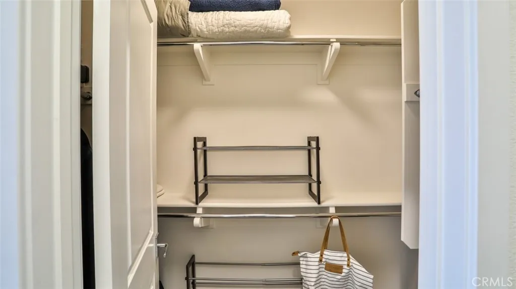 Secondary bedroom with walk-in closet and next to full hall bathroom. Secondary bedroom with walk-in closet and next to full hall bathroom.