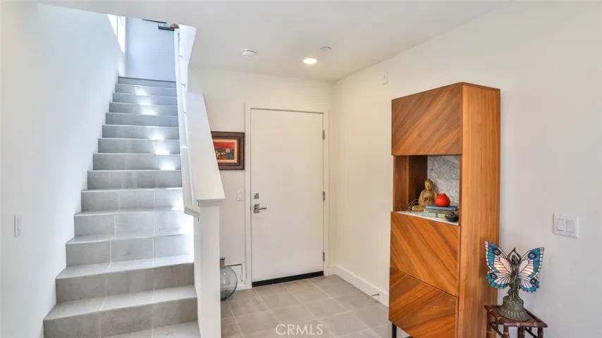 Foyer off of front patio and direct access from attached 3-car garage.