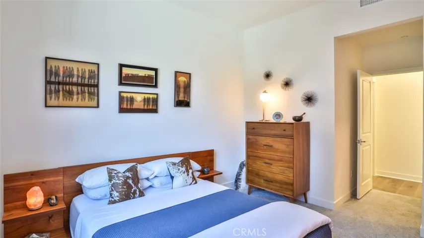 Secondary bedroom with walk-in closet and next to full hall bathroom.