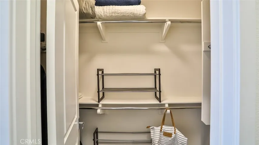 Secondary bedroom with walk-in closet and next to full hall bathroom.