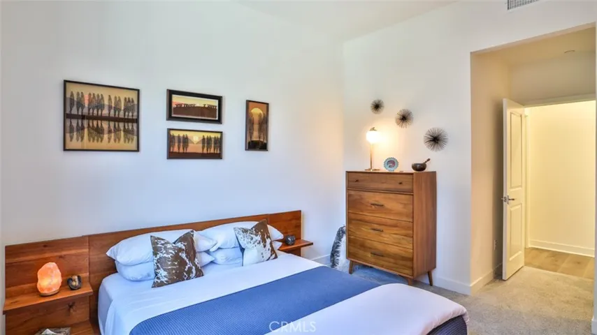 Secondary bedroom with walk-in closet and next to full hall bathroom.