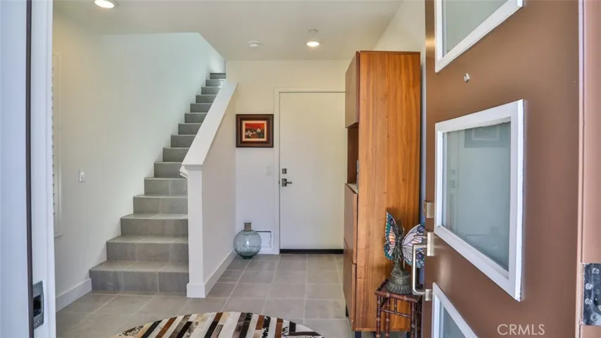 Foyer off of front patio and direct access from attached 3-car garage.