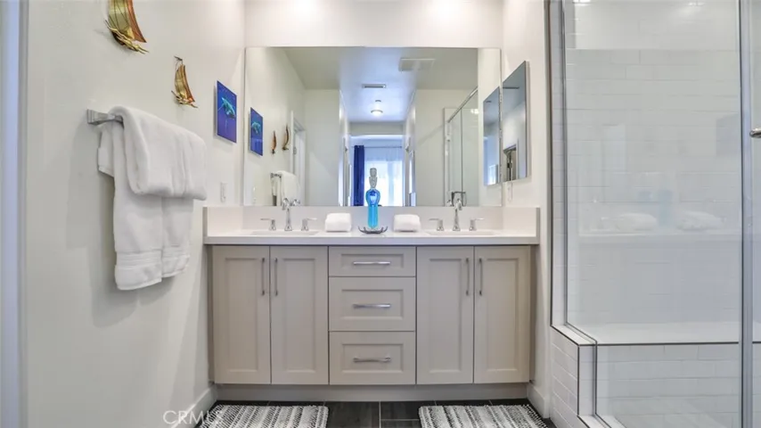 Primary bedroom with en-suite bathroom and dual closets.