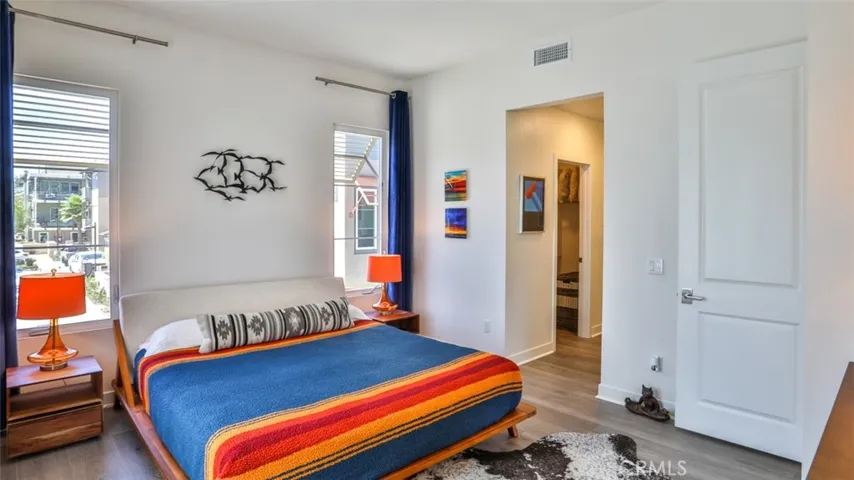 Primary bedroom with en-suite bathroom and dual closets.
