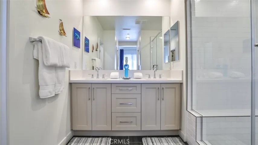 Primary bedroom with en-suite bathroom and dual closets.
