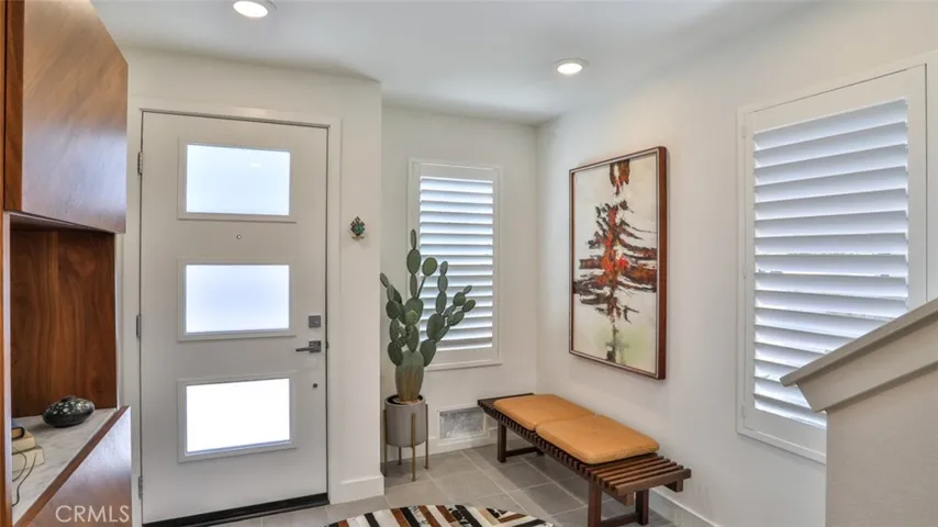 Foyer off of front patio and direct access from attached 3-car garage.