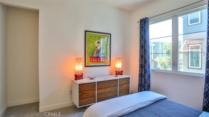Secondary bedroom with walk-in closet and next to full hall bathroom.