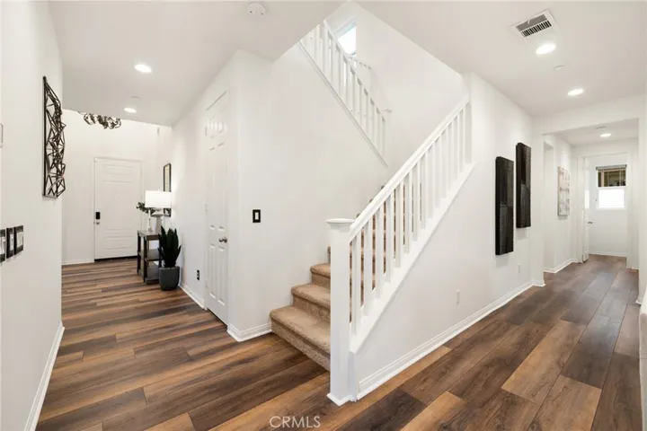 Left: Front door/dining room. Right: Flex space/laundry/main floor bath/3-car garage
