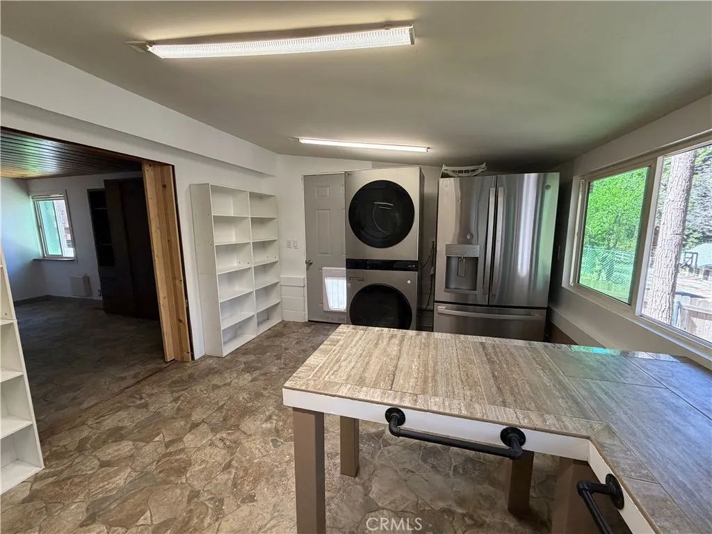 This is the studio guest house that is attached to the main house to the left side of the main house.  It has barn doors that divide this kitchen from the murphy bedroom.  This space was designed for wheel chair access.  This is a 1br/1ba., 300 feet approx size.