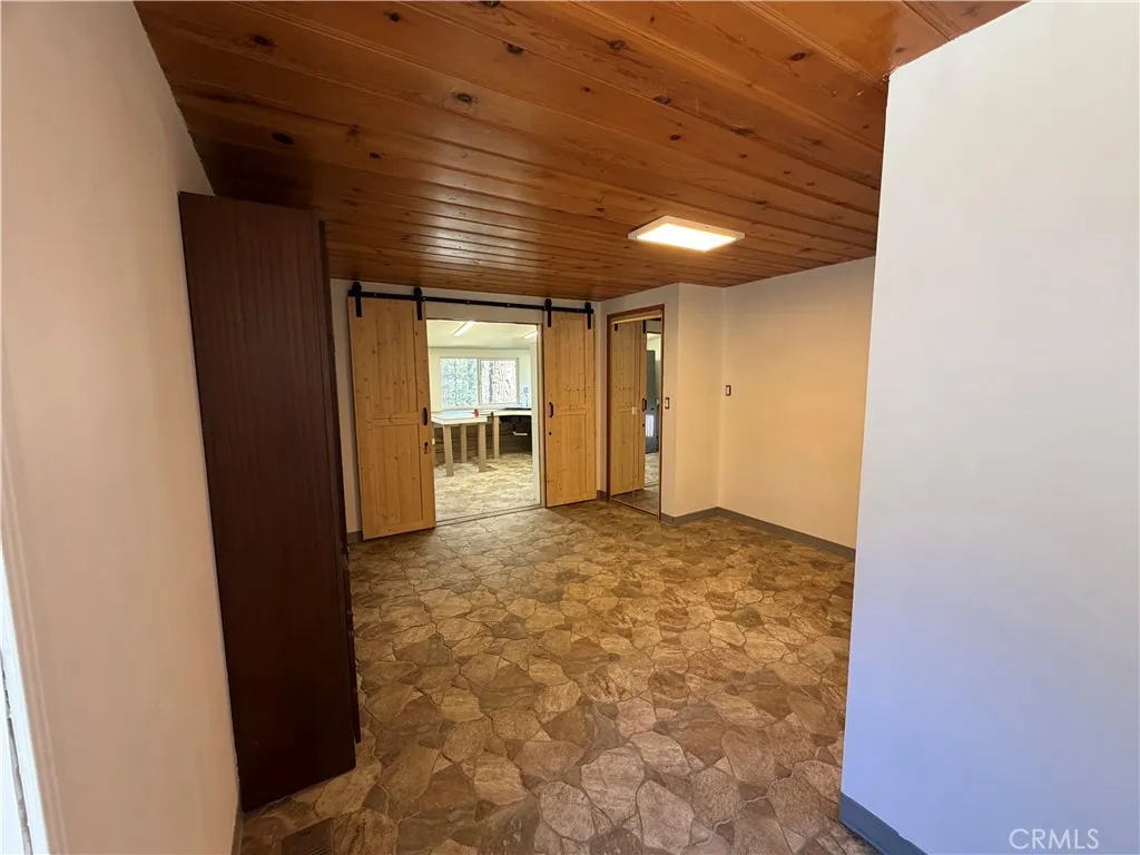 This is the studio guest house that is attached to the main house to the left side of the main house.  It has barn doors that divide this kitchen from the murphy bedroom.  This space was designed for wheel chair access.  This is a 1br/1ba., 300 feet approx size.