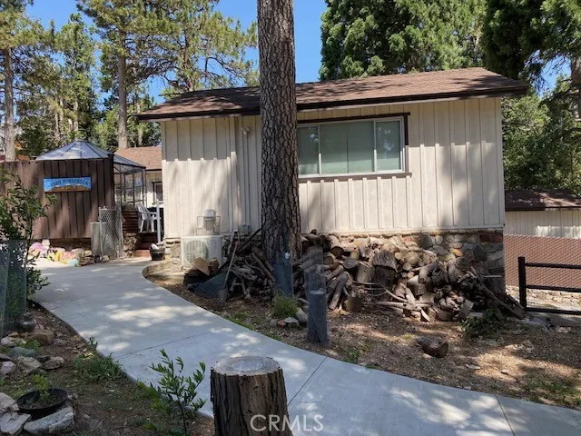 This is a side view of the 500 sq ft garage studio and you can see the slope showing how the garage is under the studio.  This is not a garage conversion.  The garage still exist and has space for one car inside the garage parking.