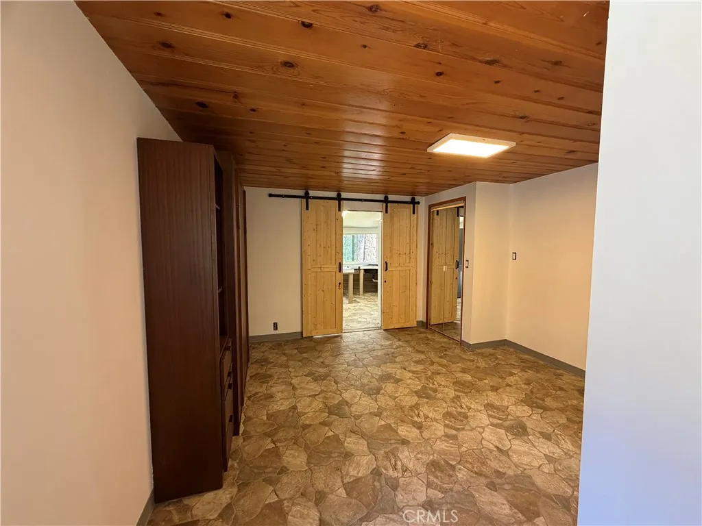 This is the studio guest house that is attached to the main house to the left side of the main house.  It has barn doors that divide this kitchen from the murphy bedroom.  This space was designed for wheel chair access.  This is a 1br/1ba., 300 feet approx size.