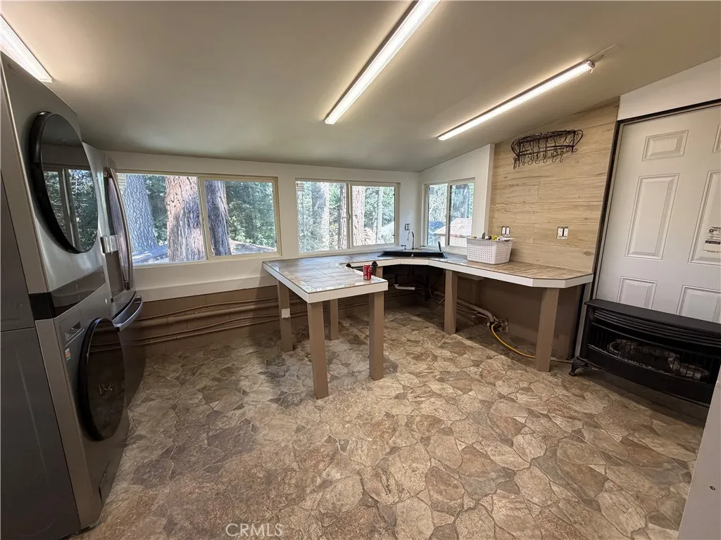 This is the studio guest house that is attached to the main house to the left side of the main house.  It has barn doors that divide this kitchen from the murphy bedroom.  This space was designed for wheel chair access.  This is a 1br/1ba., 300 feet approx size.