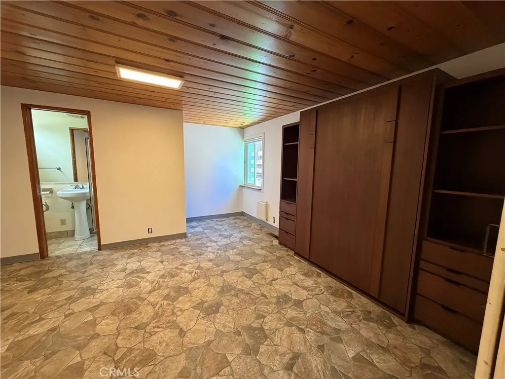 This is the studio guest house that is attached to the main house to the left side of the main house.  It has barn doors that divide this kitchen from the murphy bedroom.  This space was designed for wheel chair access.  This is a 1br/1ba., 300 feet approx size.