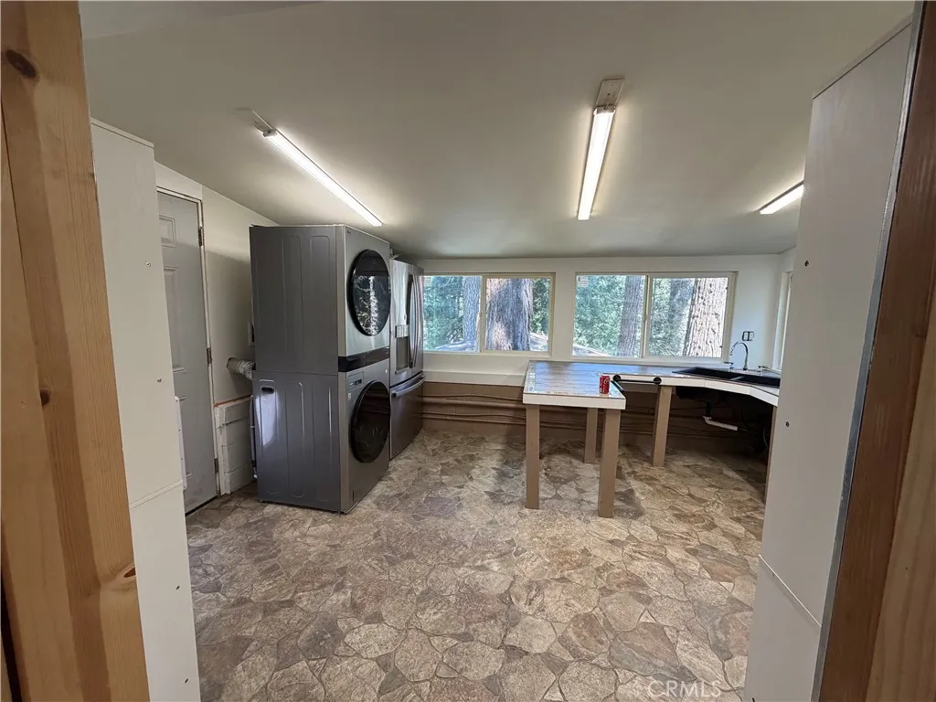 This is the studio guest house that is attached to the main house to the left side of the main house.  It has barn doors that divide this kitchen from the murphy bedroom.  This space was designed for wheel chair access.  This is a 1br/1ba., 300 feet approx size.
