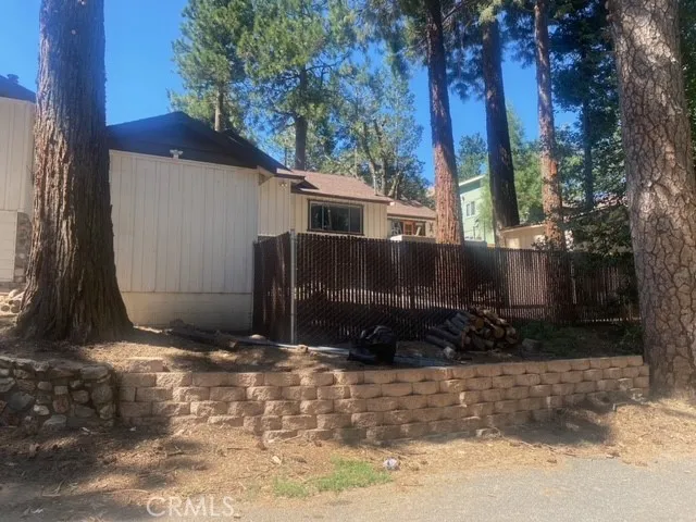 Fully covered overhead and fully enclosed chicken yard and coop inside an insulated shed.