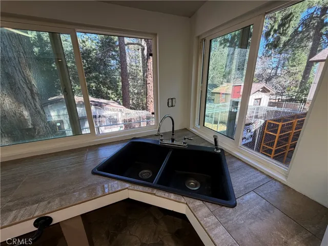 This is the studio guest house that is attached to the main house to the left side of the main house.  It has barn doors that divide this kitchen from the murphy bedroom.  This space was designed for wheel chair access.  This is a 1br/1ba., 300 feet approx size.