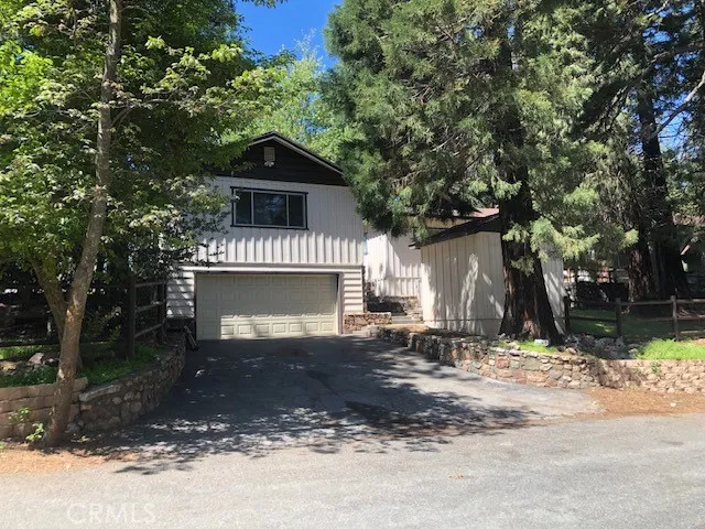 The garage fits one car and the driveway is on Coulter Pine Dr.