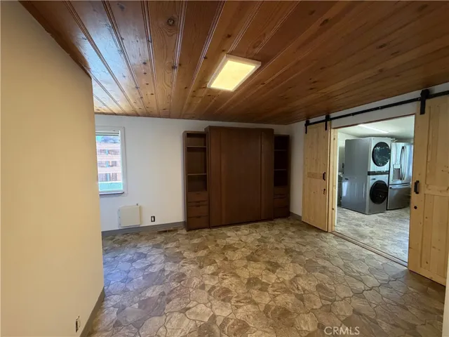 This is the studio guest house that is attached to the main house to the left side of the main house.  It has barn doors that divide this kitchen from the murphy bedroom.  This space was designed for wheel chair access.  This is a 1br/1ba., 300 feet approx size.