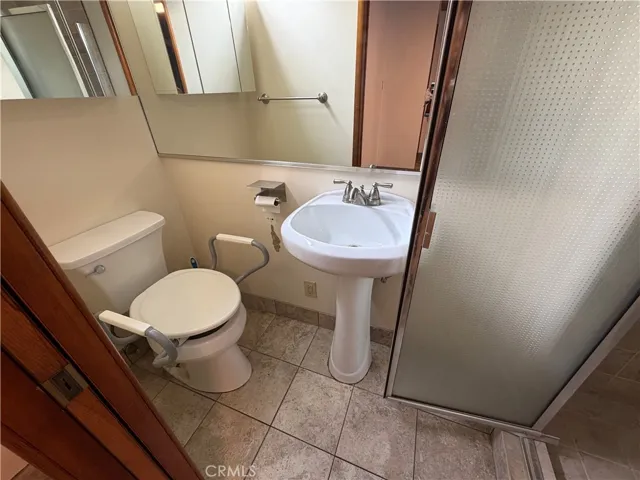 This is the studio guest house that is attached to the main house to the left side of the main house.  It has barn doors that divide this kitchen from the murphy bedroom.  This space was designed for wheel chair access.  This is a 1br/1ba., 300 feet approx size.
