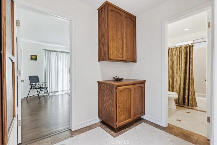 Rear bedroom with yard access and full bath.