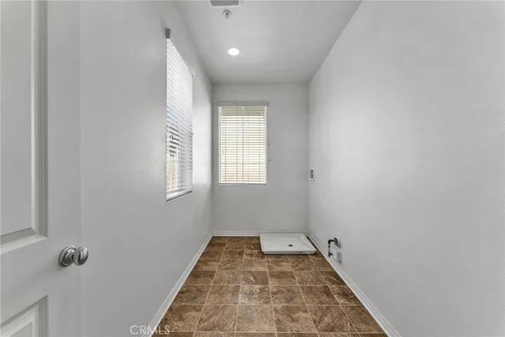 Laundry Room at 2nd floor with washer and dryer hookups and additional storage space